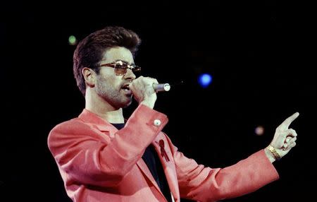 FILE PHOTO - Singer George Michael performs at the Freddie Mercury Tribute Concert for AIDS Awareness, at Wembley Stadium, in London Britain April 20, 1992. REUTERS/Dylan Martinez/File Photo