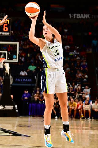 <p>Barry Gossage/NBAE via Getty</p> Maddy Siegrist shoots the ball during the Dallas Wings vs. Phoenix Mercury game on August 27, 2023 in Phoenix, Arizona.