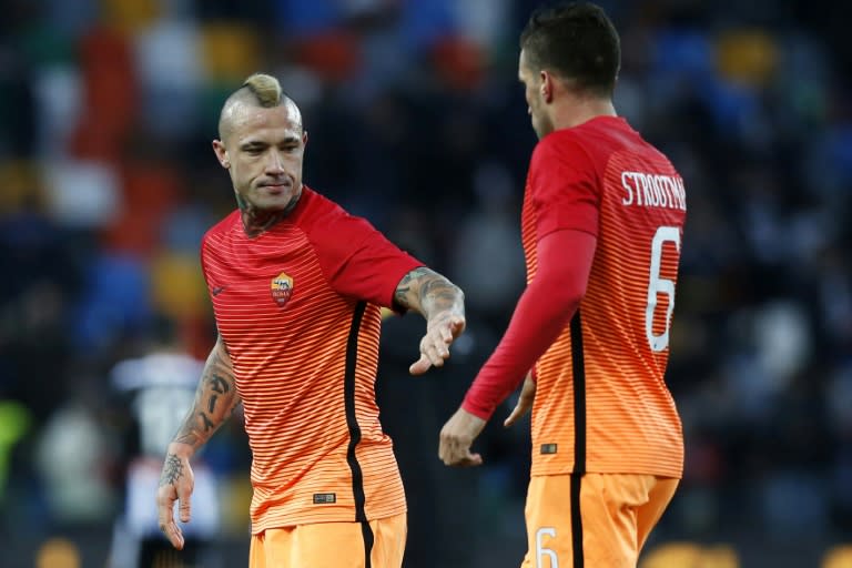 Roma's midfielder Radja Nainggolan (L) celebrates with teammate's midfielder Kevin Strootman at the end of the Italian Serie A football match against Udinese January 15, 2017