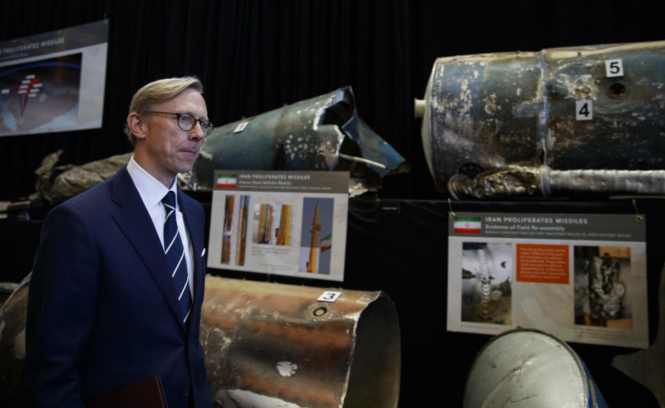 Brian Hook, U.S. special representative for Iran, walks past fragments of Iranian short range ballistic missiles (Qiam) at the Iranian Materiel Display (IMD) at Joint Base Anacostia-Bolling, in Washington, Thursday Nov. 29, 2018. The Trump administration accused Iran of stepping up violations of a U.N. ban on arms exports by sending rockets and other weaponry to rebels in Afghanistan and Yemen. The presentation displays weapons and fragments of weapons seized in Afghanistan, Bahrain and Yemen that it said are evidence Iran is a "grave and escalating threat" that must be stopped. (AP Photo/Carolyn Kaster)