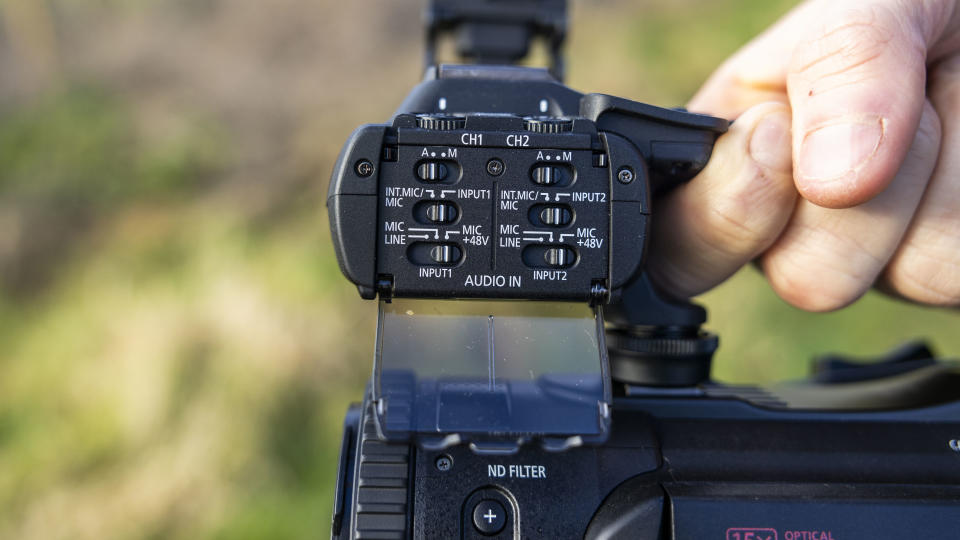 The audio channel controls on the handle of the Canon XA75 camcorder