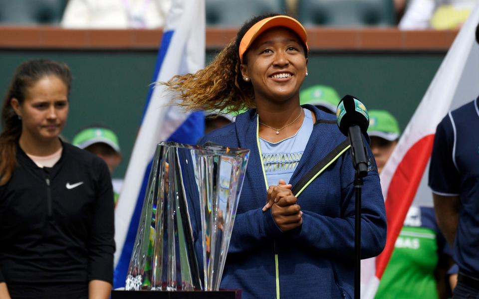 Naomi Osaka celebrates winning the Indian Wells title on Sunday - AP