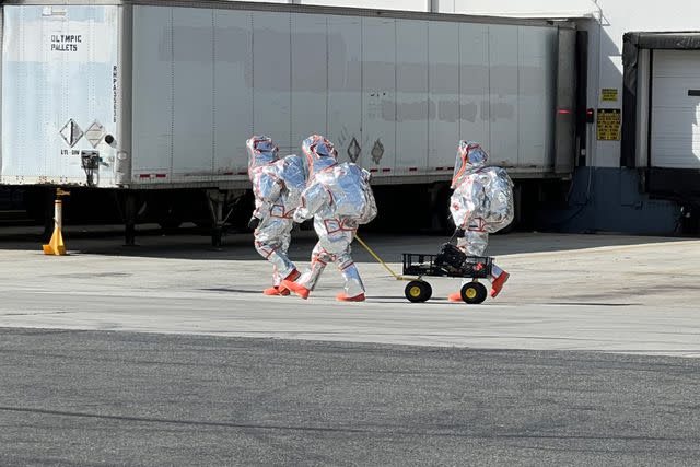 <p>OCFireAuthority/X</p> The Orange County Fire Authority hazmat crew enters the building.