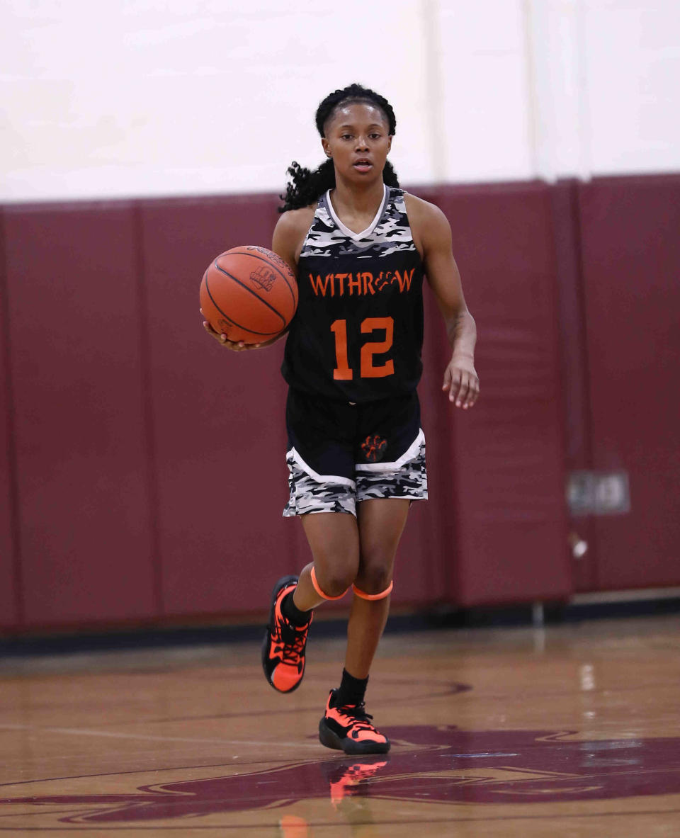 Withrow's guard Destiny Rice brings the ball up the court during their basketball game, Wednesday, Jan. 12, 2022.