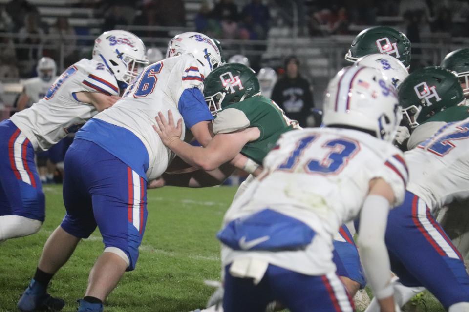 Oak Harbor's Scott Smith blocks.