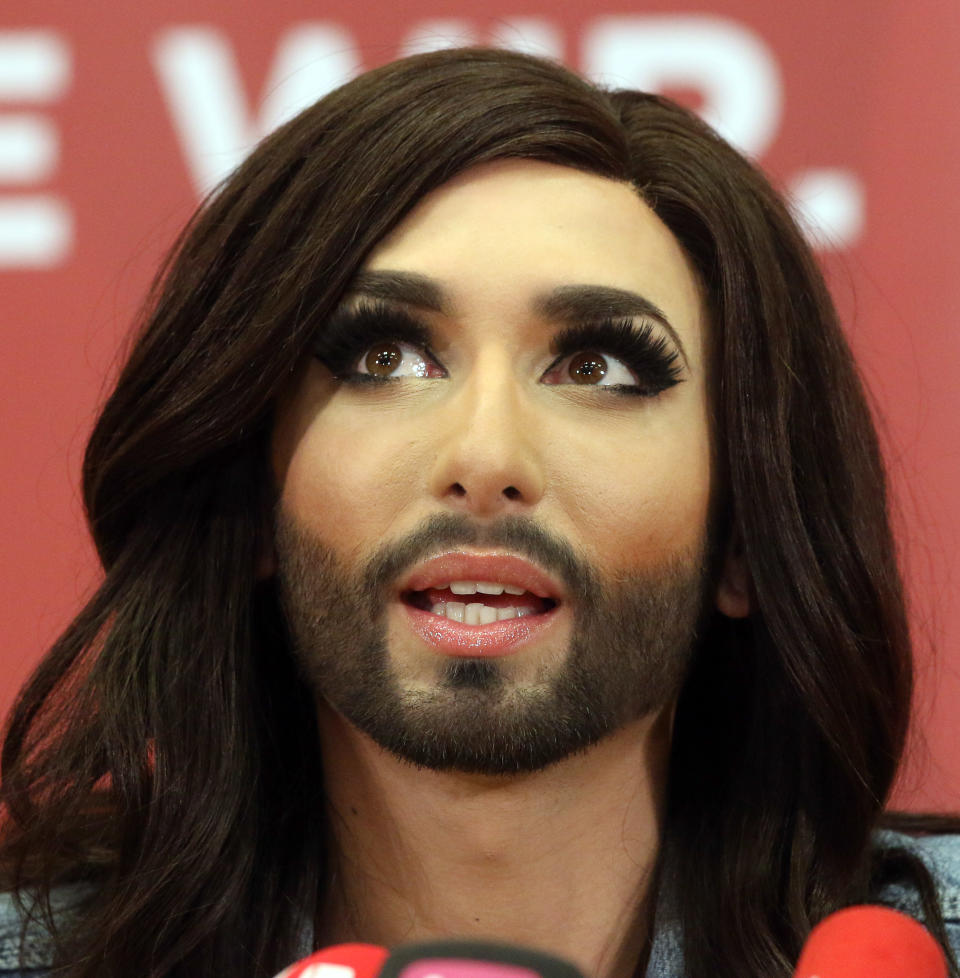 Austrian singer Conchita Wurst attends a press conference in Vienna, Austria Sunday May 11, 2014. Bearded drag queen Conchita Wurst has made a triumphant return to Austria after winning the Eurovision Song Contest in Copenhagen Saturday, in what the country's president called a victory for tolerance in Europe. (AP Photo/Ronald Zak)