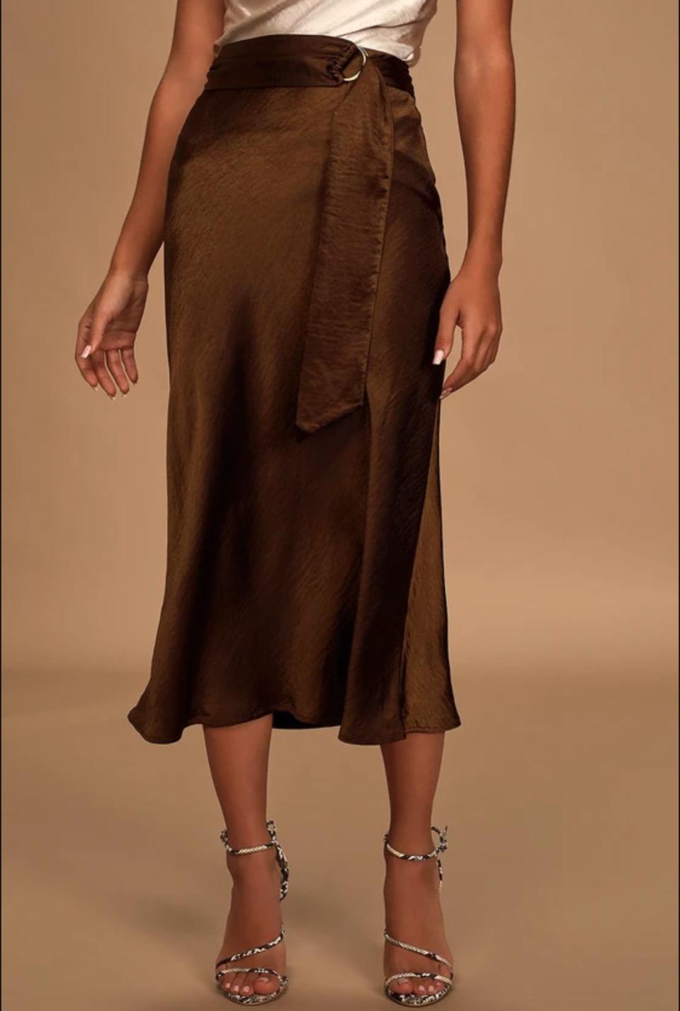 Get the <a href="https://www.lulus.com/products/unforgettable-brown-satin-belted-midi-slip-skirt/974822.html" target="_blank" rel="noopener noreferrer">Moon River unforgettable brown satin mini slip skirt from Lulus for $83</a>