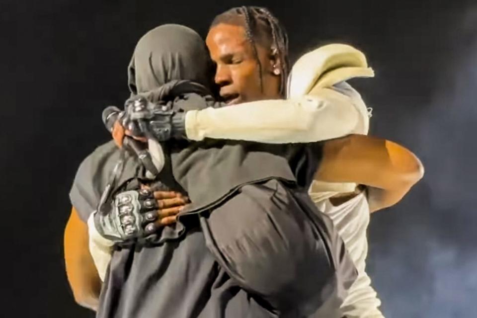 <p>SplashNews.com</p> The two rappers embrace on stage Monday night in Rome, Italy.