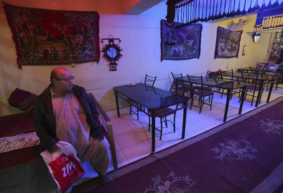 Zabulon Simantov, an Afghan Jew, sits inside his cafe in Kabul