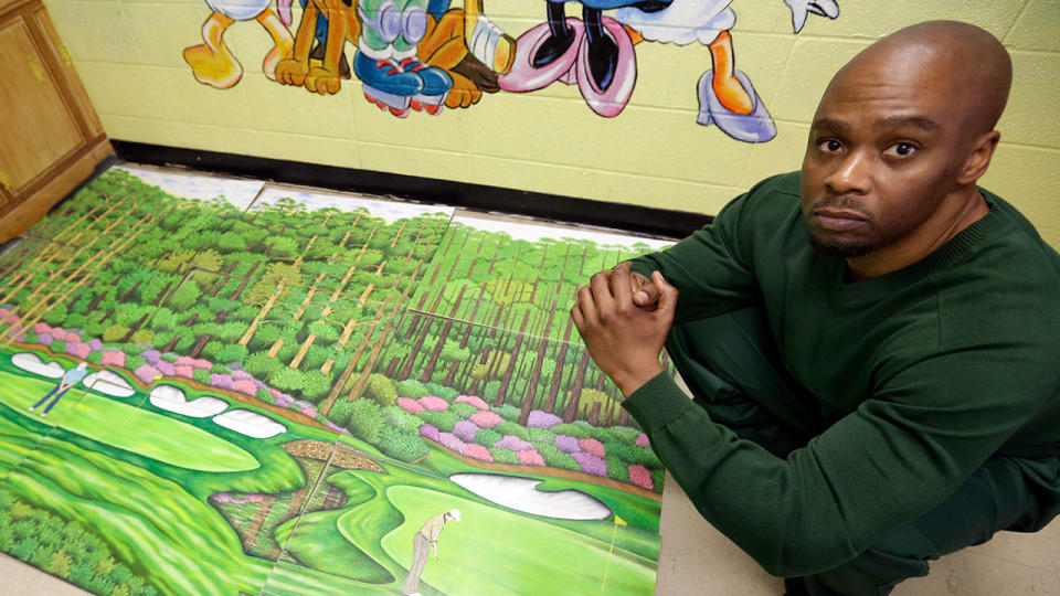 Valentino Dixon with one of his pieces of golf art. Pic: AP