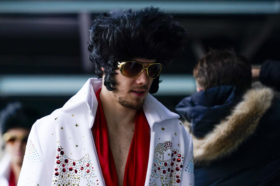 Vegas Golden Knights players arrive dressed in Elvis outfits before the NHL Winter Classic hockey game against the Seattle Kraken, Monday, Jan. 1, 2024, in Seattle. (AP Photo/Lindsey Wasson)