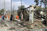 Afghan Municipality workers work at the site of an explosion in Kabul, Afghanistan, Wednesday, Sept. 9, 2020. Afghanistan’s Interior Ministry said the bombing in Kabul targeting the convoy of the country’s first vice president killed many people and wounded more than a dozen others, including several of the vice president’s bodyguards. First Vice President Amrullah Saleh suffered minor burns in the attack on Wednesday morning. (AP Photo/Rahmat Gul)