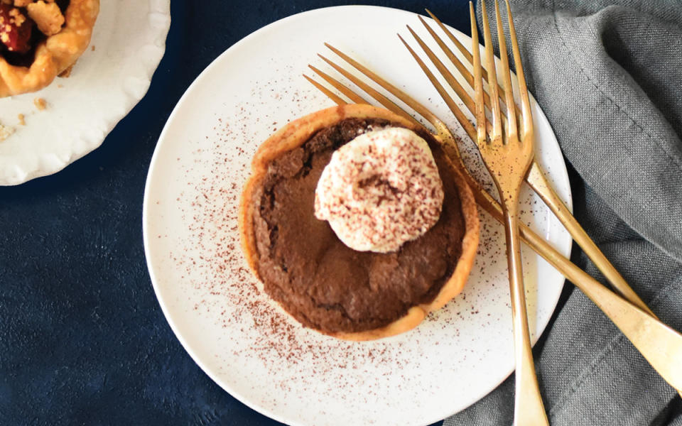 <p>Teresa Blackburn</p><p>A creamy chocolate filling goes into a store-bought pie crust.</p><p><strong>Get the recipe: <a href="https://parade.com/1294870/parade/chocolate-chess-mini-pies/" rel="nofollow noopener" target="_blank" data-ylk="slk:Chocolate Chess Mini Pies;elm:context_link;itc:0;sec:content-canvas" class="link ">Chocolate Chess Mini Pies</a></strong></p>