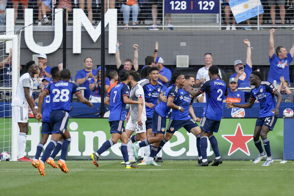 FC Cincinnati's Santiago Arias celebrates with teammates after scoring a goal against Toronto FC during the first half of an MLS soccer match Wednesday, June 21, 2023, in Cincinnati. (AP Photo/Jeff Dean)