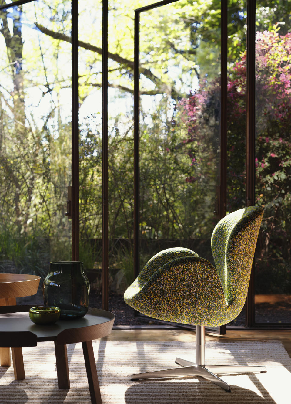 DWR will release exclusive fabrics from Raf Simons and Kvadrat on Fritz Hansen’s Swan Chair, shown here in green.