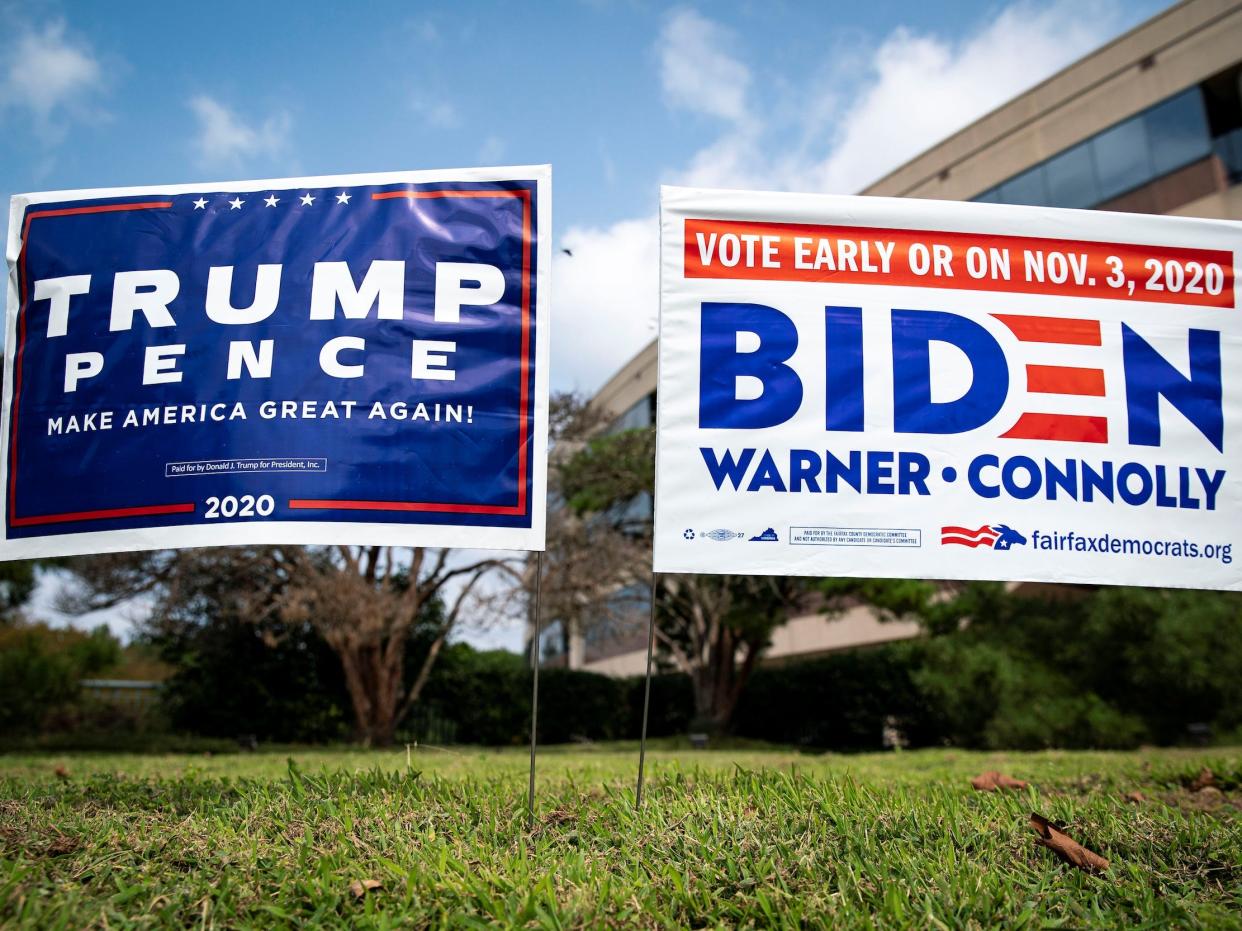 Yard signs supporting U.S. President Donald Trump and Democratic U.S. presidential nominee and former Vice President Joe Biden are seen outside of an early voting site at the Fairfax County Government Center in Fairfax, Virginia, U.S., September 18, 2020.