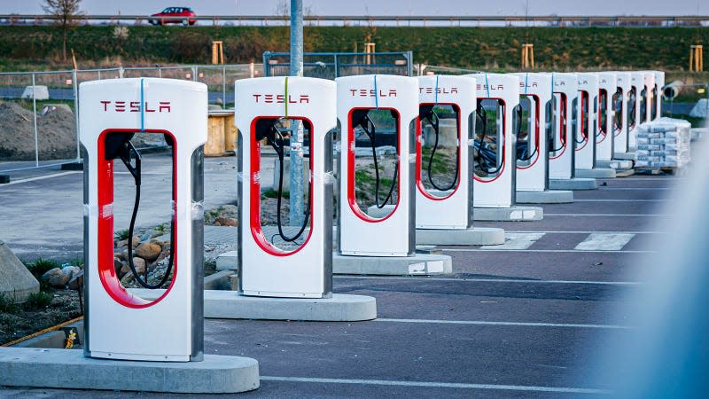 A photo of a bank of Tesla Super Chargers. 