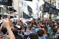 Demonstrators gesture and chant slogans during a protest against the cartoon publications of Prophet Mohammad in France and comments by the French President Emmanuel Macron, in Beirut