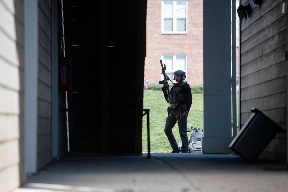 Police swarmed the Seasons at Cane Creek apartments March 29, 2023.