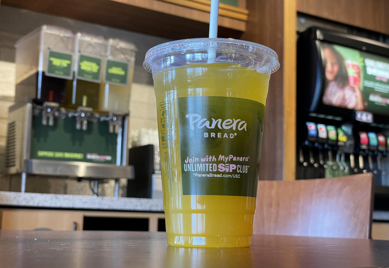 A cup of Charged Lemonade on a table at a Panera Bread restaurant.