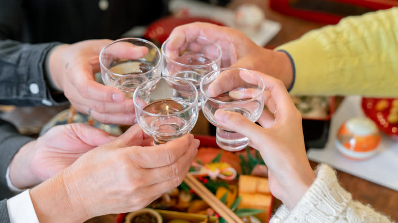 people cheering sake