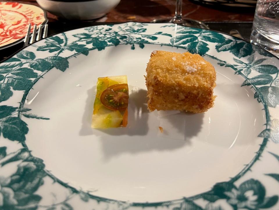 A plate of fried fish with an accompaniment.