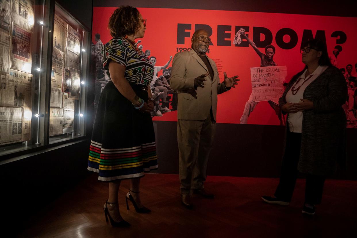 Monica Anthony, left, Rev. Wendell Anthony, president of Detroit NAACP, middle, and Cynthia Jones attend a media tour of Mandela: The Official Exhibition inside the Henry Ford Museum in Dearborn on Thursday, Oct. 19, 2023. The exhibit will be from Oct. 21, 2023, to Jan. 15, 2024.