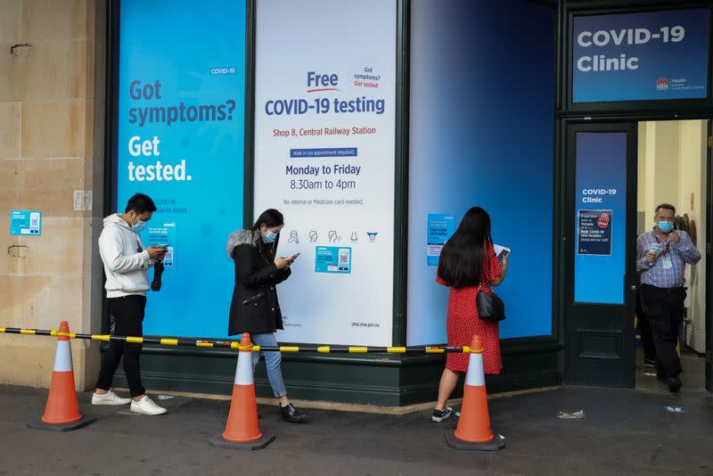 People wait in line at a coronavirus disease (COVID-19) testing clinic in Sydney