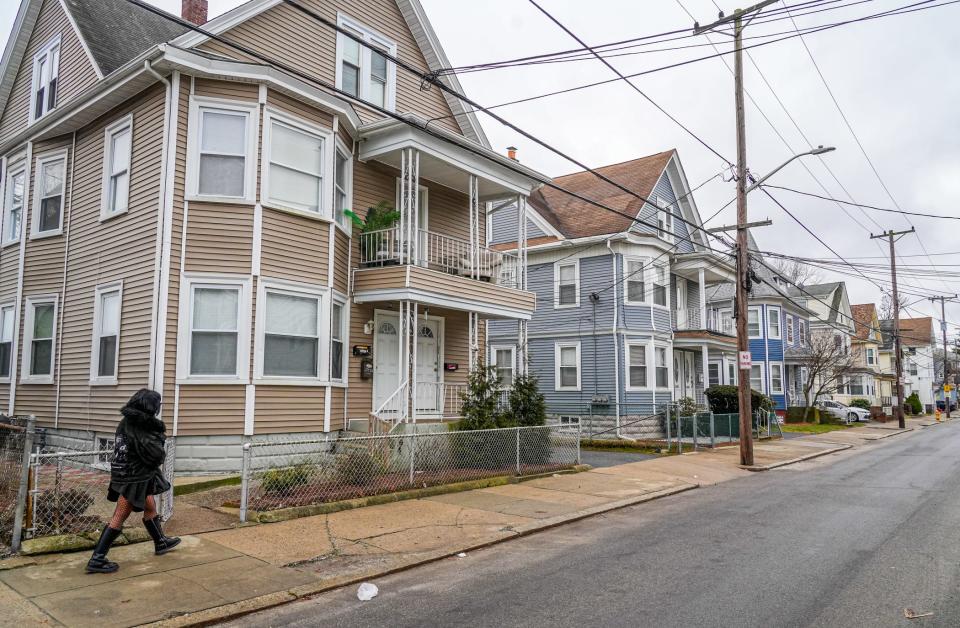 Pacific Street in Central Falls, lined with three-story apartment houses. The story of the triple-decker is “intimately interwoven with the story of immigration,” says C. Morgan Grefe, executive director of the Rhode Island Historical Society.