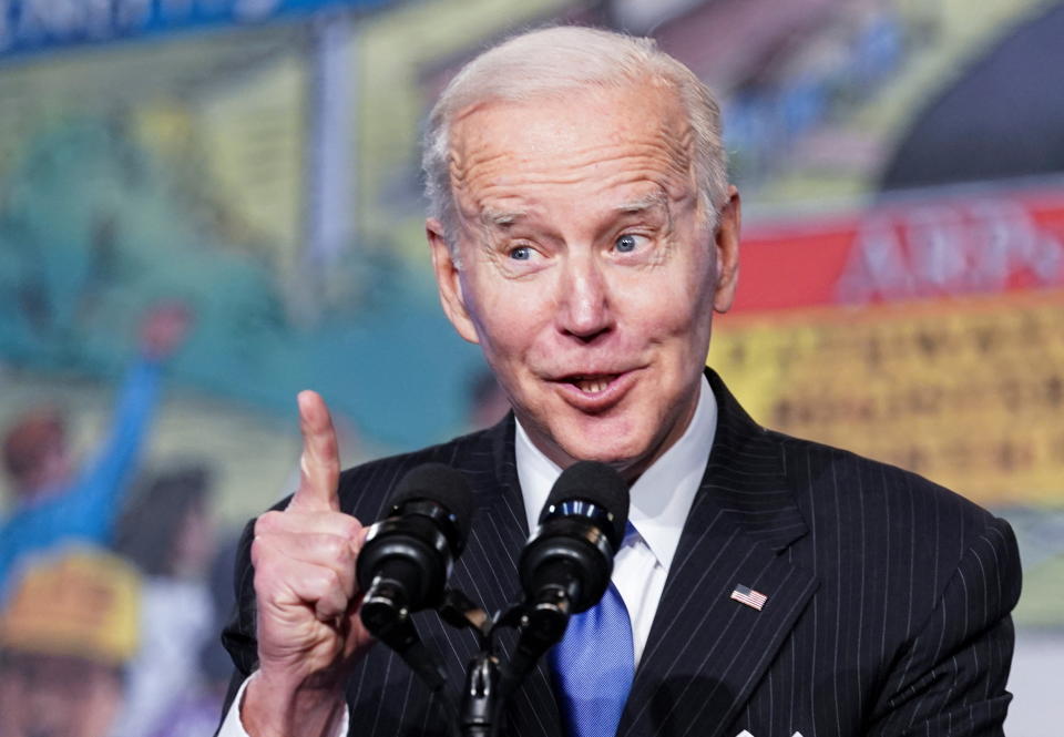 President Biden stands at a microphone as he addresses the North America’s Building Trades Unions Legislative Conference. 