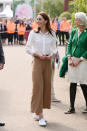 <p>The Duchess of Sussex chose a casual ensemble to present her ‘Back to Nature’ garden ahead of the Chelsea Flower Show. Dressed for the great outdoors, the mother-of-three finished her ensemble with her go-to pair of £50 2750 Cotu Classic Superga trainers. <a rel="nofollow noopener" href="https://www.superga.co.uk/item/23/Superga/2750-COTU-CLASSIC-White.html" target="_blank" data-ylk="slk:Shop now;elm:context_link;itc:0;sec:content-canvas" class="link ">Shop now</a>. <em>[Photo: Getty]</em> </p>