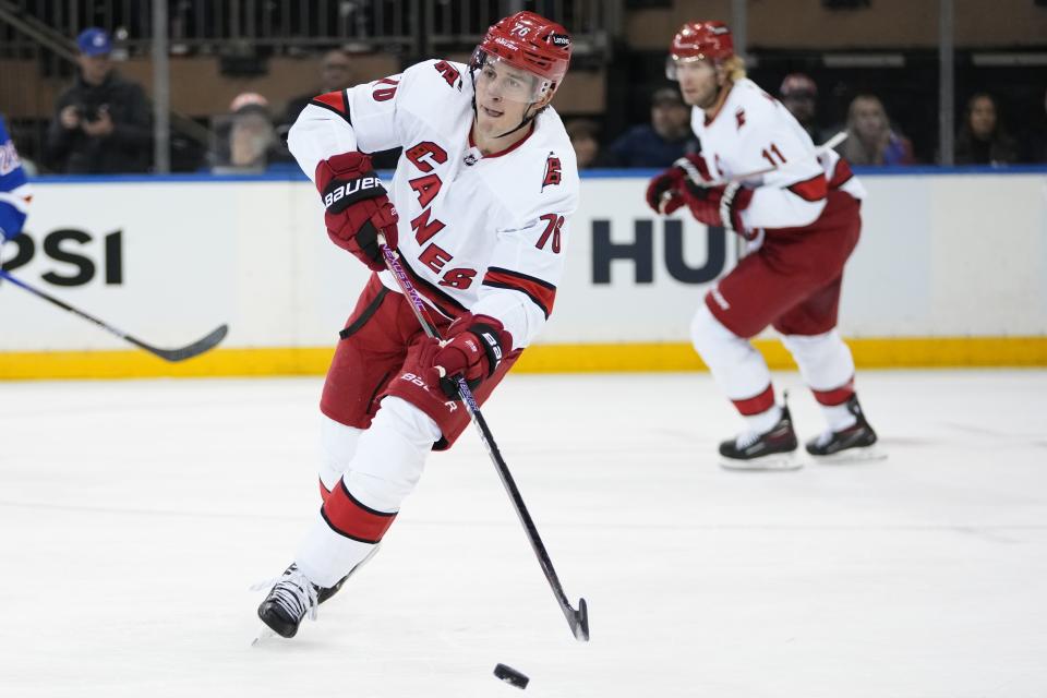 Carolina Hurricanes' Brady Skjei (76) looks to pass the puck during the first period of an NHL hockey game against the New York Rangers Thursday, Nov. 2, 2023, in New York. (AP Photo/Frank Franklin II)