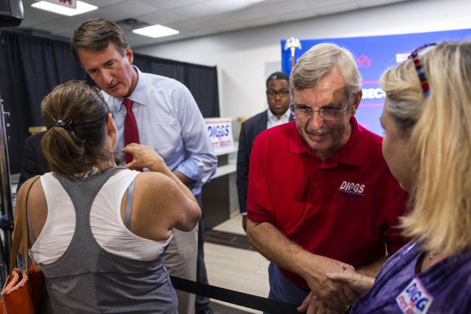 FILE - Governor of Virginia Glenn Youngkin and 24th district state senate candidate Danny Diggs speak with supporters following an early voting rally in Newport News, Va., Sept. 20, 2023. Control of Virginia’s legislature is up for grabs in Tuesday's off-year general election. Republicans hold a slim majority in the House of Delegates, while Democrats hold an equally narrow majority in the state Senate. All 40 state Senate seats and 100 state House seats will be on the ballot. (Kendall Warner/The Virginian-Pilot via AP)