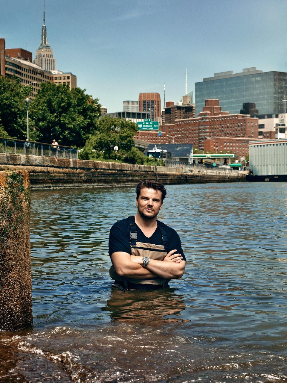 <strong><em>BIG–Bjarke Ingels Group—dryline</em></strong> Charged with protecting ten miles of Manhattan’s waterfront in the aftermath of Hurricane Sandy, AD100 architect Ingels (right) has envisioned a ribbon of community and cultural spaces that would both engage the public and withstand future floods. Nicknamed the Dryline, his forthcoming park—winner of the local Rebuild by Design competition—will combine a raised landscape of protective berms and resilient plants with re­creational features such as skate parks, undulating double benches, and winding bicycle paths. In the event of rising waters, art walls deploy as shutters, serving as an emergency barrier. Rain or shine, the Dryline promises to do the city proud.