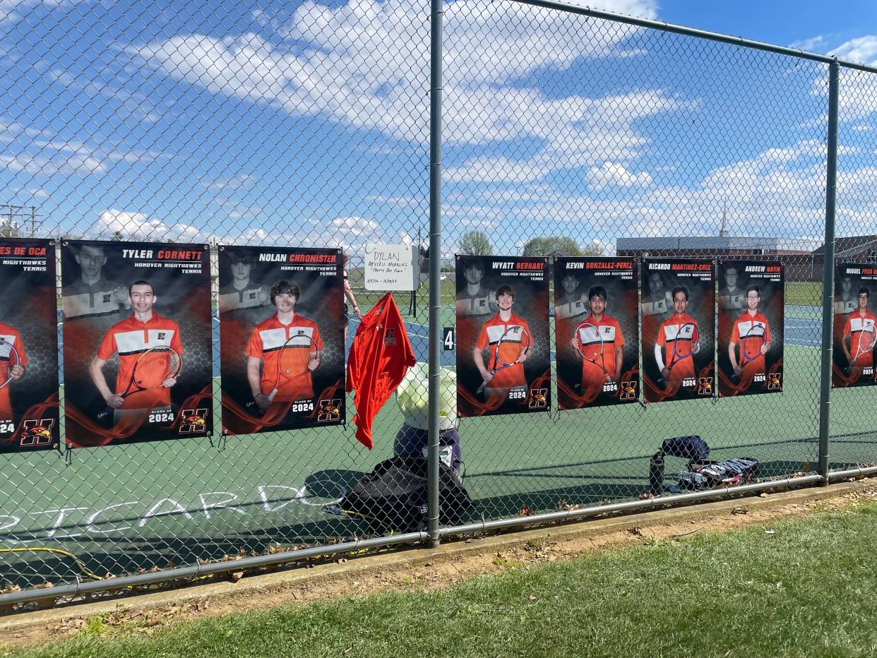 Hanover boys' tennis team has a memorial for Dylan Arvizu Morales hanging with the senior banners to keep his presence with them as they practice and play.