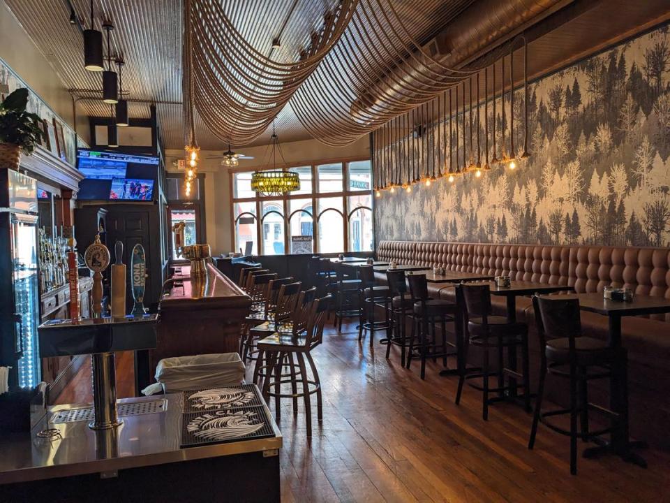 A view of the entry area with bar and seating at 1860 Public House in Red Bud