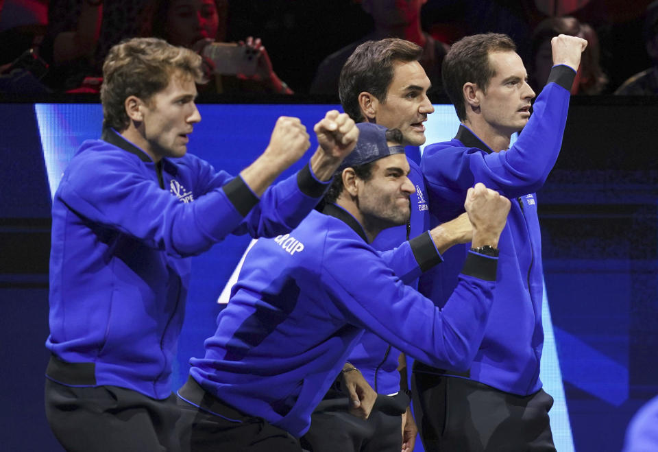 Team Europe's Casper Rudd, Matteo Berrettini, Roger Federer and Andy Murray watch Team Europe's Cameron Norrie play Team World's Taylor Fritz in a men's singles match, on the second day of the Laver Cup tennis tournament at the O2 in London, Saturday, Sept. 24, 2022. (John Walton/PA via AP)