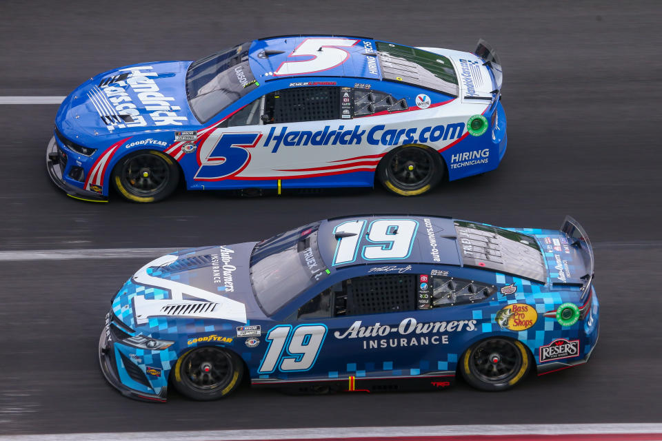 ATLANTA, GA - JULY 09: Martin Truex, Jr (#19 Joe Gibbs Racing Auto-Owners Insurance Toyota) and Kyle Larson (#5 Hendrick Motorsports HendrickCars.com Chevrolet) race side by side during the NASCAR Cup Series Quaker State 400 on July 9, 2023 at Atlanta Motor Speedway in Atlanta, GA. (Photo by Chris McDill/Icon Sportswire via Getty Images)