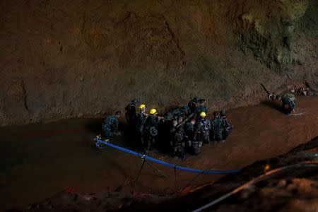 Soldiers and rescue workers work in Tham Luang cave complex, as an ongoing search for members of an under-16 soccer team and their coach continues, in the northern province of Chiang Rai, Thailand, July 1, 2018. REUTERS/Soe Zeya Tun