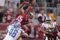 San Francisco 49ers wide receiver Jauan Jennings (15) catches a pass against Detroit Lions linebacker Jack Campbell (46) during the second half of the NFC Championship NFL football game in Santa Clara, Calif., Sunday, Jan. 28, 2024. (AP Photo/Mark J. Terrill)