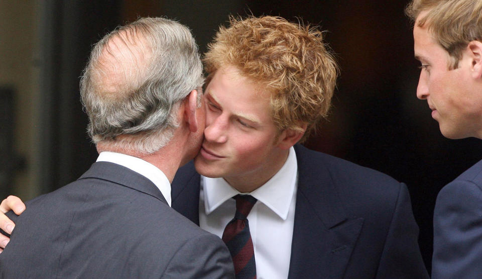 Britain's Prince Charles (L) is greeted by Princes William (R) and Harry (C), sons of the late Princess Diana, as they prepare to greet guests as they arrive for the Service of Thanksgiving for the Life of Diana at the Guards' Chapel at Wellington Barracks in London, August 31, 2007. Hundreds of mourners gathered in Paris and London on Friday to mark the tenth anniversary of the death of Princess Diana, an object of enduring fascination around the world.  REUTERS/Pool/Lewis Whyld/WPA/PA Wire (BRITAIN)