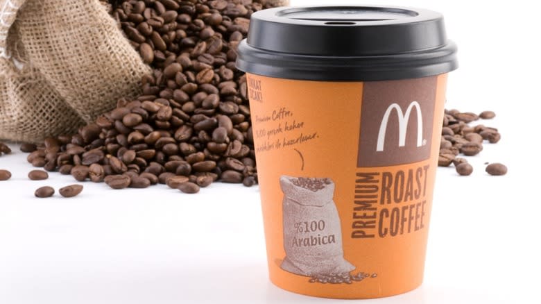 McDonald's coffee beside bean bag