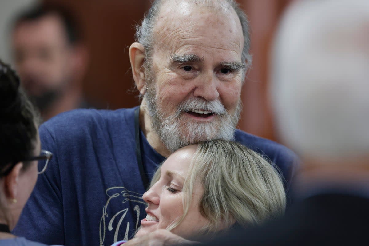Larry Woodcock hugs an attendee after the verdict was read in the Lori Vallow trial last year (AP)