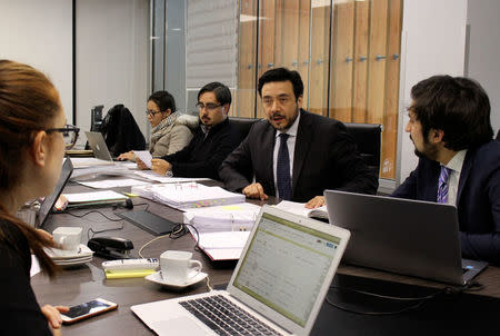 Chilean prosecutor Emiliano Arias, who is leading an investigation against alleged sex abuse crimes by Roman Catholic priests, is seen at his work place in Rancagua, Chile, July 18, 2018. Picture taken July 18, 2018. REUTERS/Esteban Medel