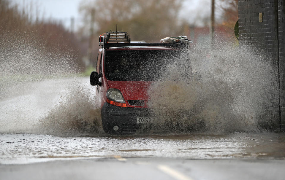 A van is driven through floodwater in Sedgebrook, Lincolnshire.