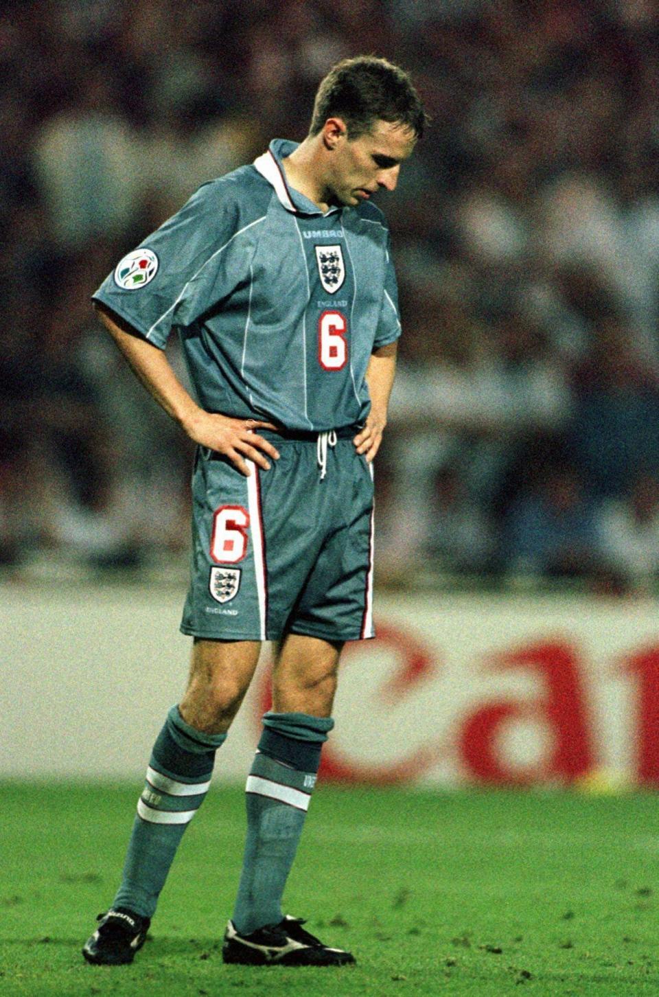 FILE - In this June 26, 1996 file photo England's Gareth Southgate bows his head after missing from the spot during a penalty shootout in the European Soccer Championships semi-final match against England at London's Wembley Stadium. Germany won 6-5 on penalties after the match finished 1-1 following extra time. Current England coach Gareth Southgate missed the decisive kick in the shootout, and Germany went on to win the title. (AP Photo/Lynne Sladky, File)