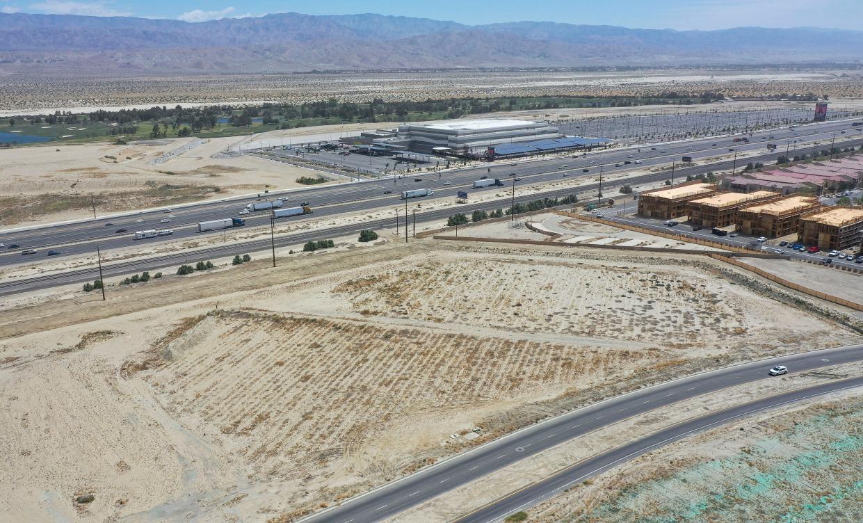 The city of Palm Desert is considering using this plot of empty land, seen last week, for a potential rail station. The land is situated between Interstate 10 and Gerald Ford Drive, at bottom, and also near Acrisure Arena, seen at top right.