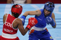 Columbia's Ingrit Lorena Valencia Victoria, left, exchanges punches with India's Chungneijang Mery Kom Hmangte during their women's flyweight 51-kg boxing match at the 2020 Summer Olympics, Thursday, July 29, 2021, in Tokyo, Japan. (AP Photo/Frank Franklin II)