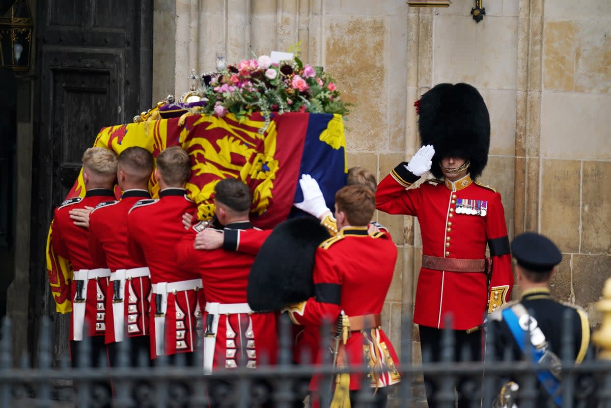 The Queen’s coffin has been topped with flowers (Andrew Milligan/PA) (PA Wire)