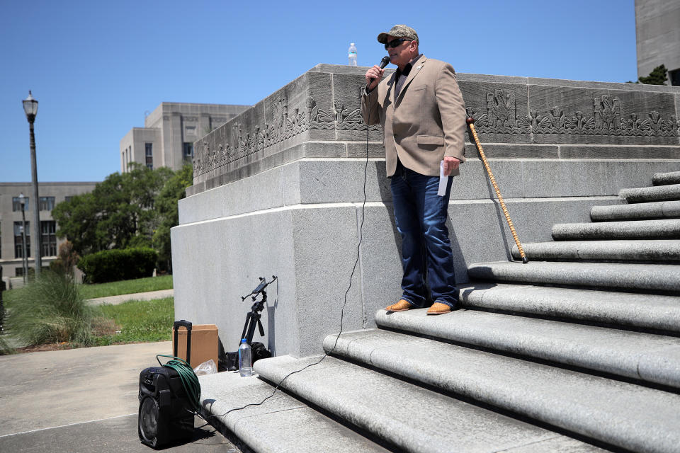 Louisiana State Representative Danny McCormick speaks to protesters in Baton Rouge as they gather outside the state capitol to rally against Louisiana's stay-at-home order and economic shutdown, April 25, 2020.<span class="copyright">Chris Graythen—Getty Images</span>